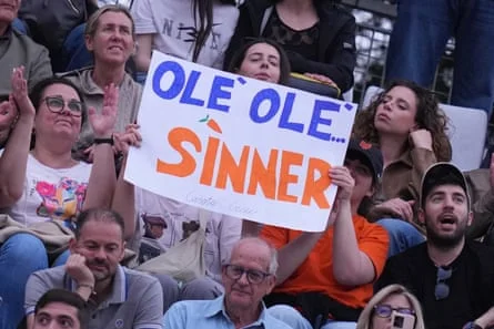 Jannik Sinner supporters hold up a banner saying “Olé olé Sinner”
